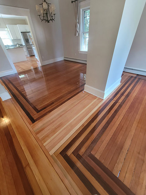 Dark & light brown patterned polished hardwood flooring